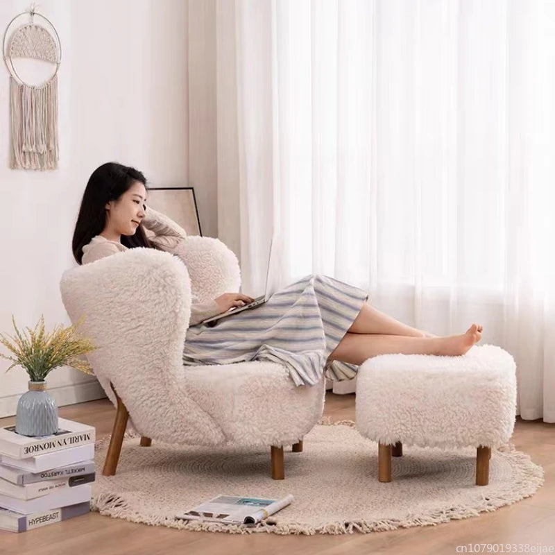Woman relaxing on a fluffy armchair in a cozy living room.