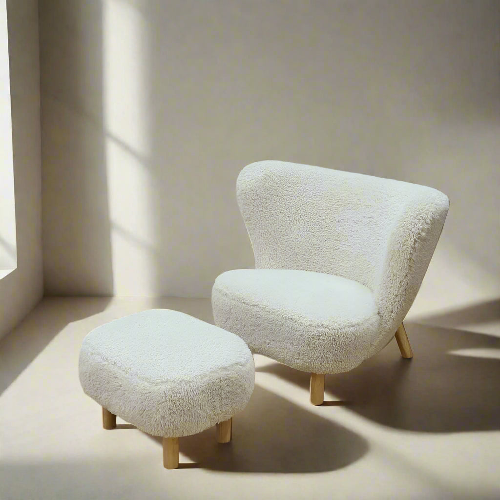 Fluffy beige armchair and ottoman on a wooden floor with product dimensions displayed.